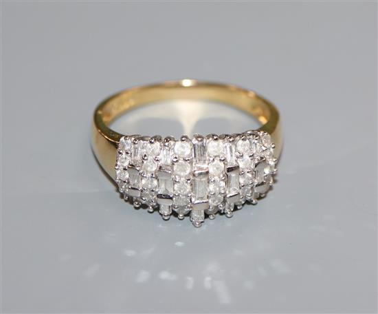 An 18ct gold brilliant and baguette diamond set dress ring, size U